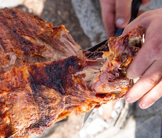 Cutting freshly cooked meat