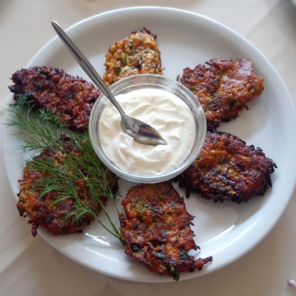 Fried zucchini patties with white dip