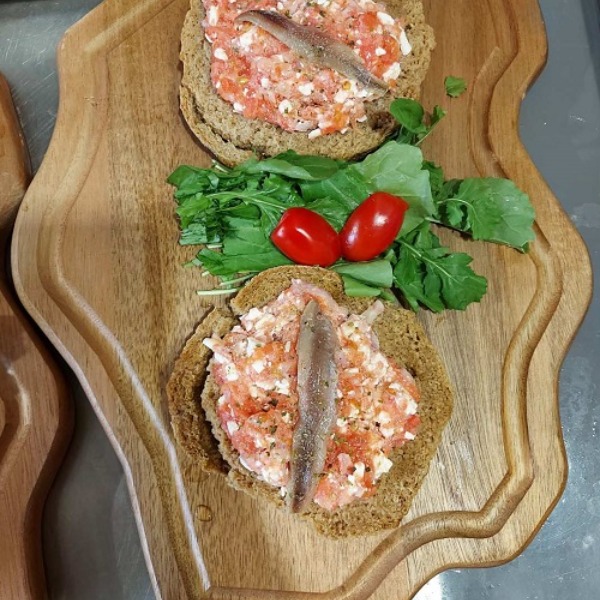 Rusks with dip, salad, and fish